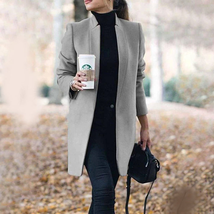 Fashionable women's long winter coat with a classic tailored lapel, ideal for sophisticated outerwear.