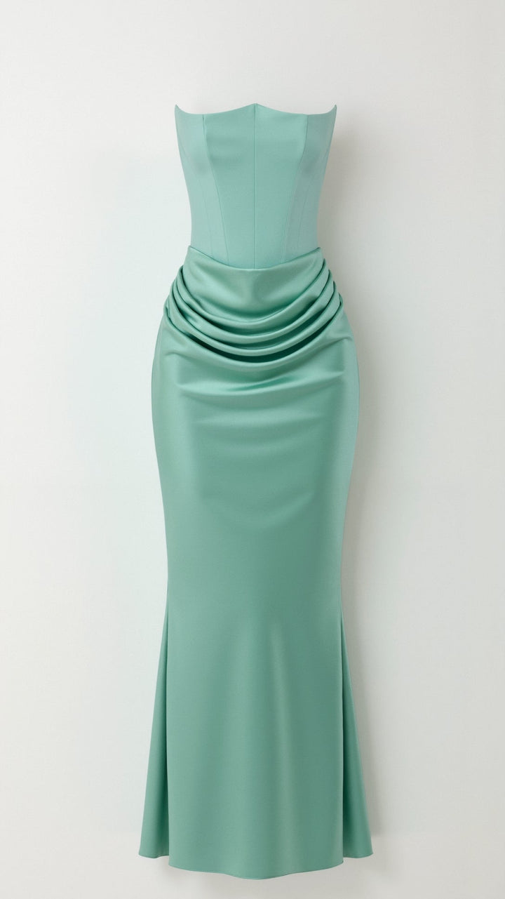 Elegant sleeveless column maxi dress paired with delicate jewelry for a wedding guest look