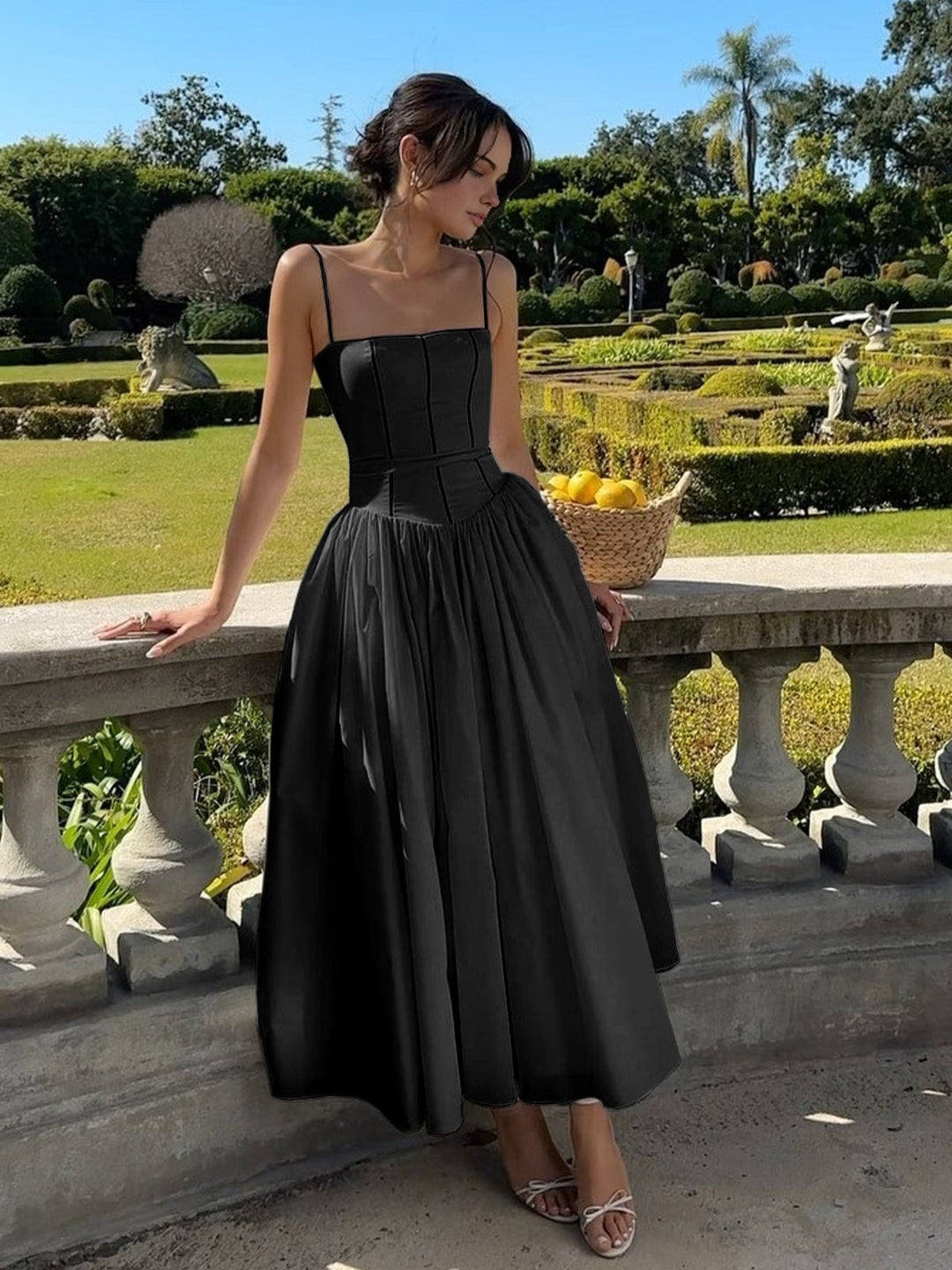 Full-length view of a stunning women's elegant midi dress, featuring a flattering corset bodice