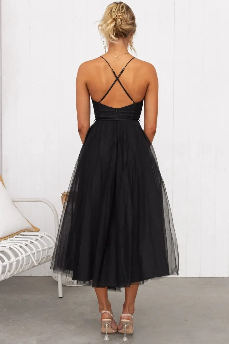 Stylish women's elegant midi dress with corset details & spaghetti straps. Versatile for formal events.