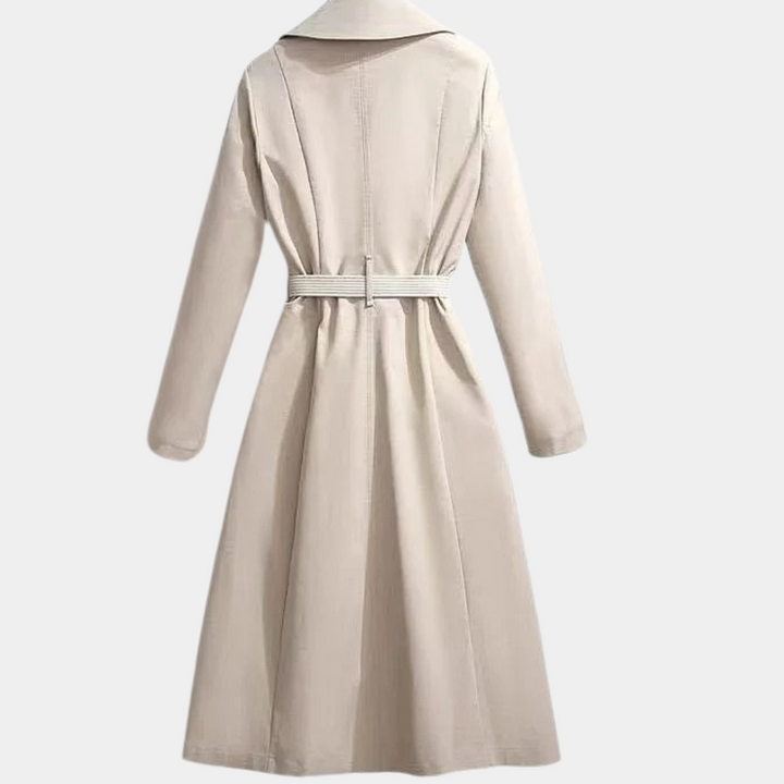 Fashionable women's double-breasted trench coat with belt, showcasing a sophisticated outerwear style.