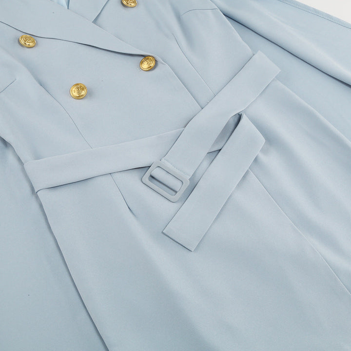 Beautifully tailored women's cape dress, double-breasted and accessorized with a belt.