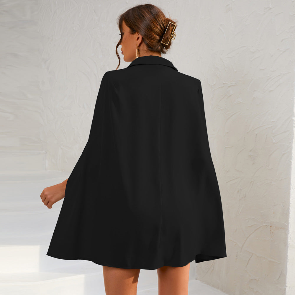 Chic women's double-breasted cape dress, featuring a stylish belt and tailored design.