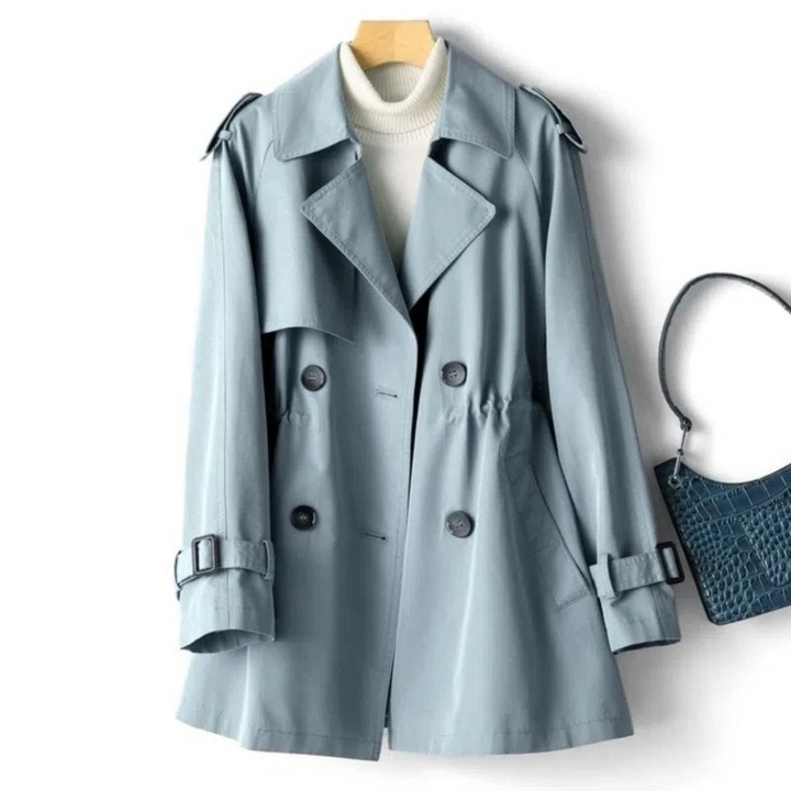 Fashionable women's long double-breasted coat with belt, ideal for fall and winter outerwear.