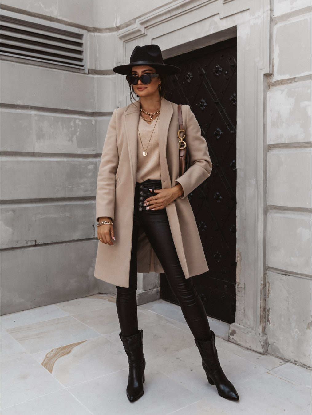 Elegant women's double-breasted long trench coat in classic beige, perfect for fall fashion.