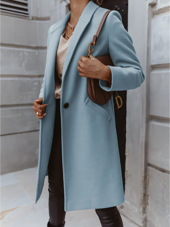Classic women's double-breasted trench coat, long length for a sophisticated fall and winter look.