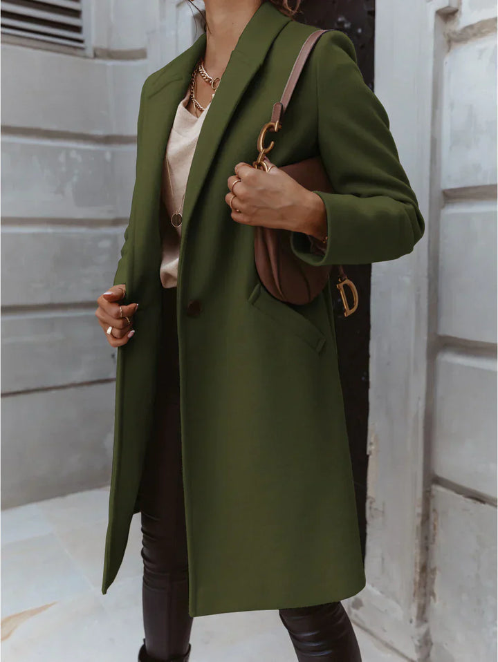 Back view of a women's elegant long trench coat, showcasing classic design for fall fashion.