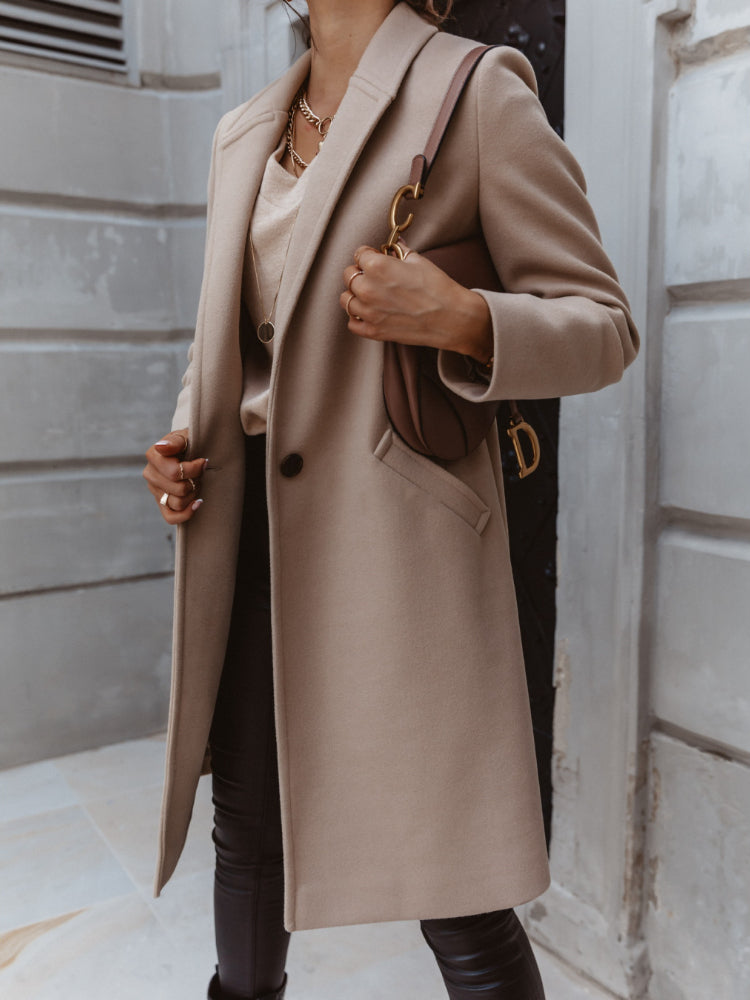 Women's long trench coat in a rich navy color, double-breasted and perfect for winter outerwear.