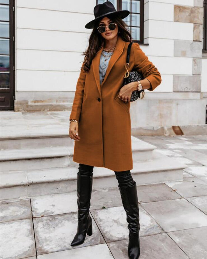 Model wearing a women's double-breasted long trench coat, demonstrating its elegant fit and style.