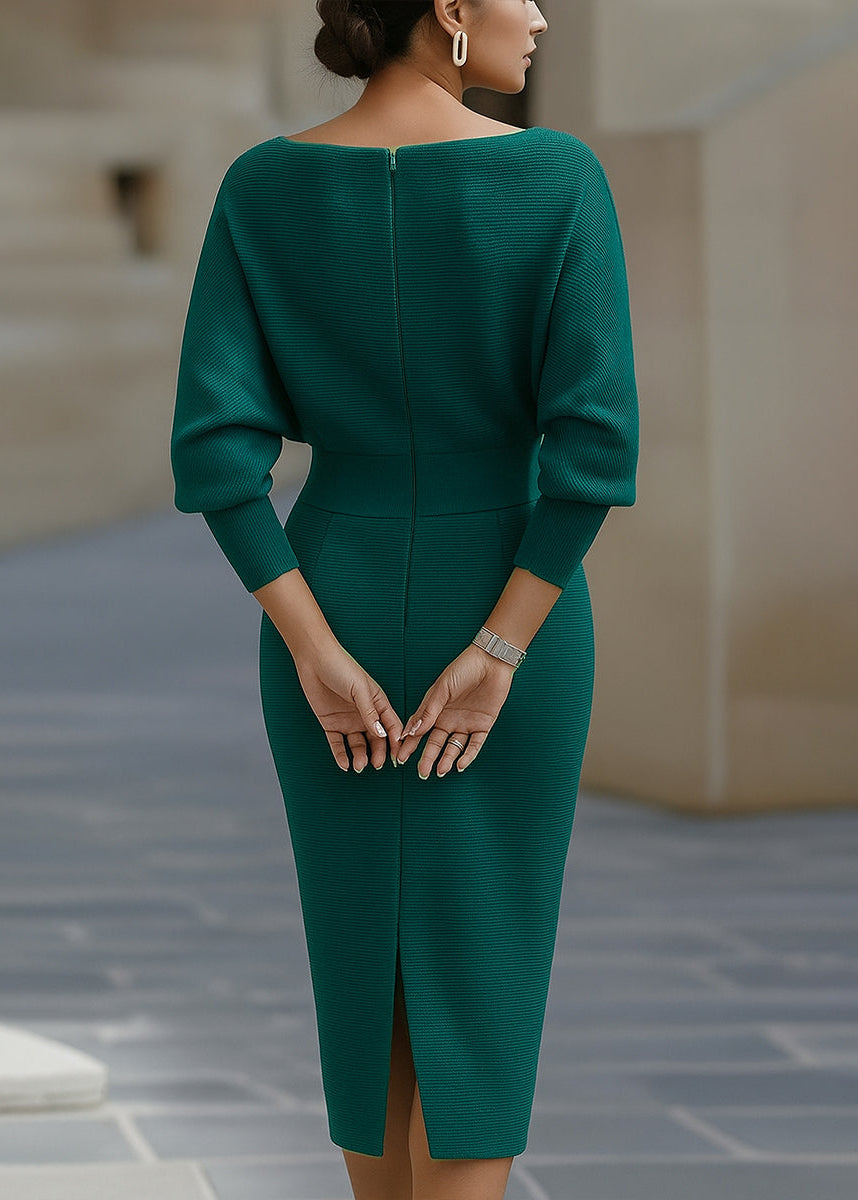 Close-up of elegant cowl neck & draped batwing sleeves on women's midi dress. Polished fall fashion detail.