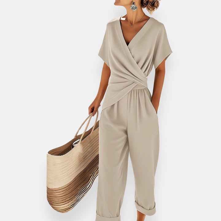 Stylish women's draped bow jumpsuit, a comfortable & trendy fashion choice for formal or evening events.