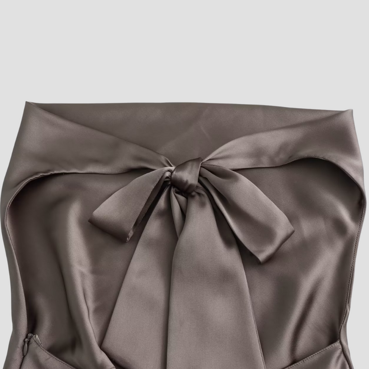 Women's sleek sleeveless satin tank top featuring a chic draped halter design; ideal party wear.