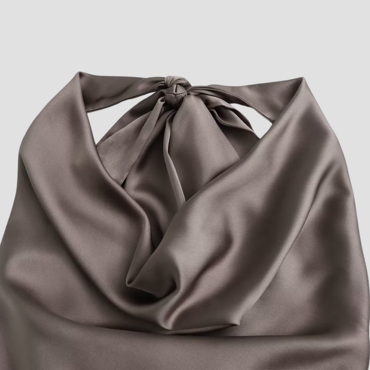 Stylish women's draped satin halter top; a versatile and elegant blouse for various occasions.