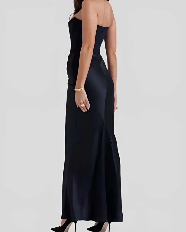 Stylish women's long dress with draped silhouette, perfect as an elegant wedding guest outfit or for formal occasions.