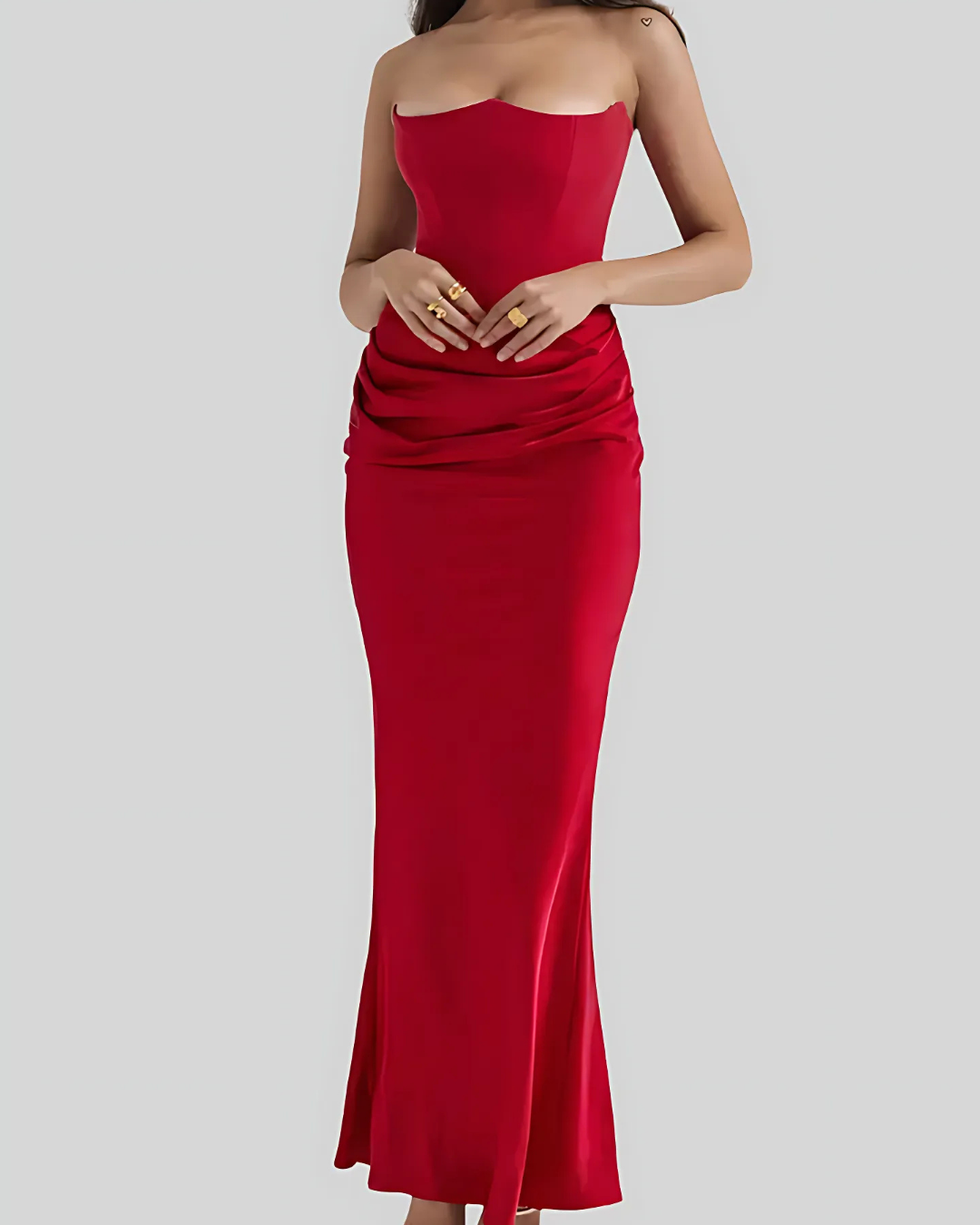 Beautiful occasionwear women's maxi dress featuring intricate draping, suitable for a wedding or formal evening event.