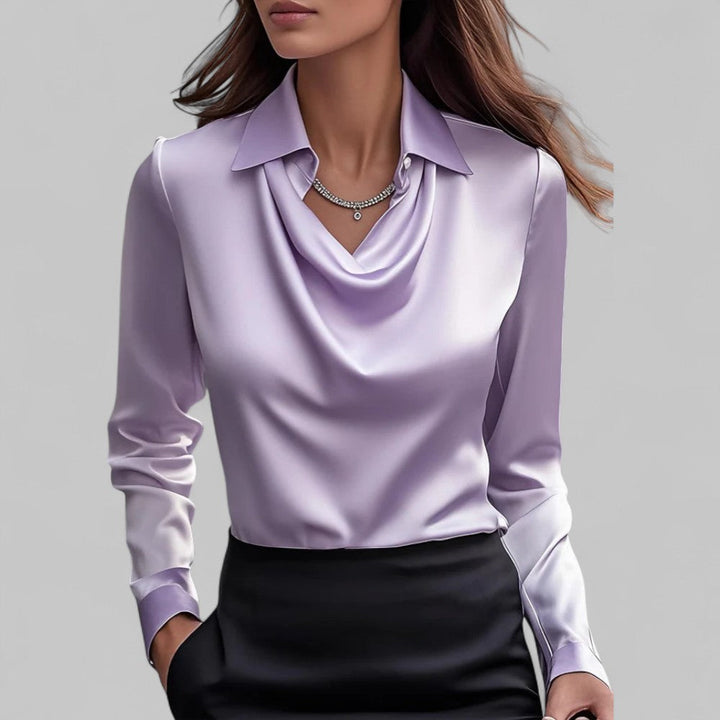 Chic women's blouse in a lustrous satin fabric with an elegant draped neck design.