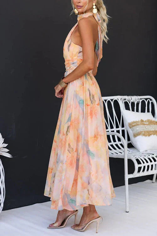 Summer-ready women's floral maxi dress with a chic halter neckline, showcasing a bohemian flow
