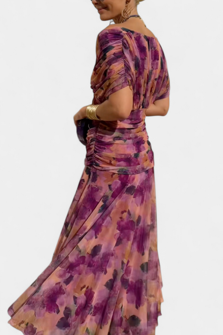 Elegant women's floral maxi dress featuring a flattering waistline. Captivating flowy design, ideal for parties.