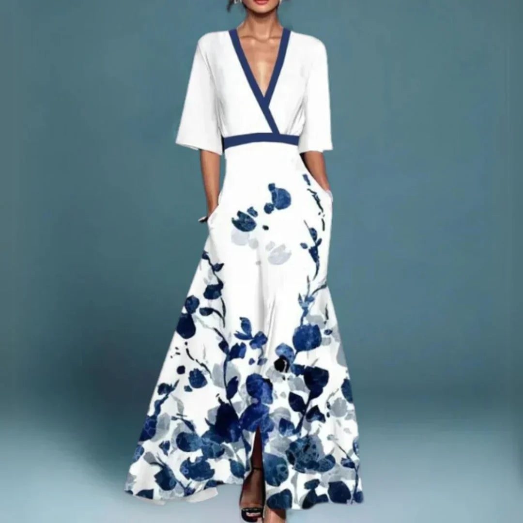 Flattering long sleeve women's floral maxi wrap dress. Features a v-neck and flared hem, ideal for elegant day wear.