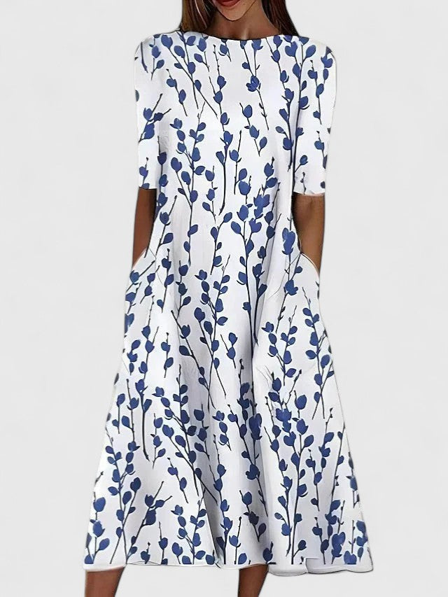 Elegant women's floral midi dress, perfect for summer. Features a round neck and comfortable, effortless style.