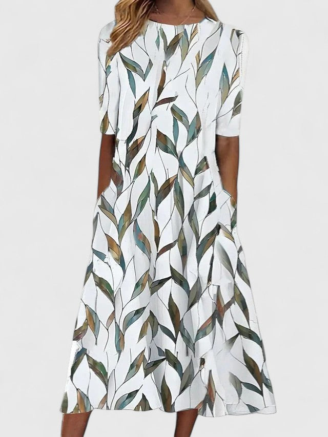 Effortless floral midi dress for women, perfect for summer. Comfortable round neck design, available in plus sizes.