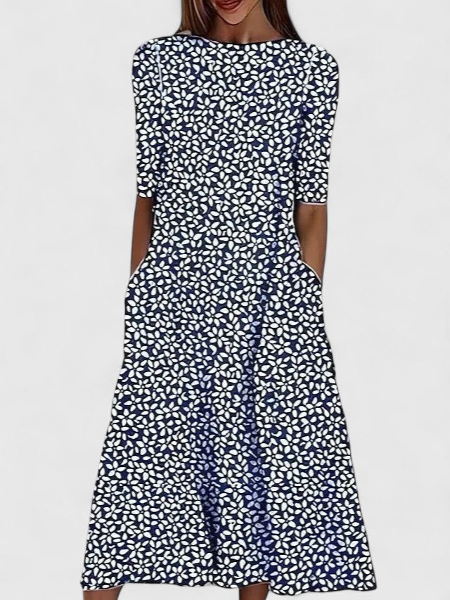Women's elegant floral midi dress with a round neck, suitable for summer and casual occasions. Vibrant floral pattern.
