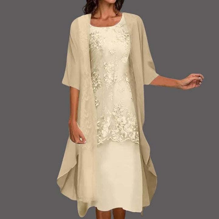 Elegant women's floral midi dress with a sheer cardigan set, perfect for occasion wear or summer events.