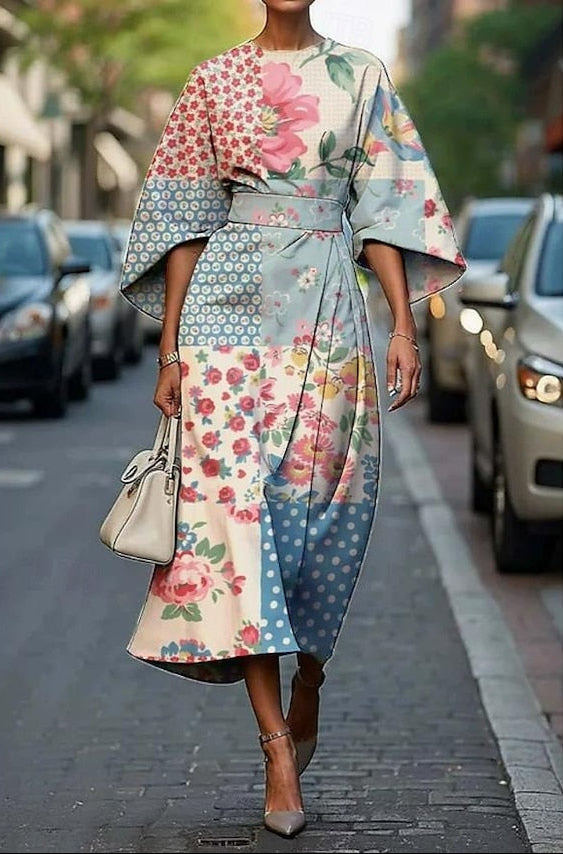 Women's elegant floral print midi dress, featuring a flattering belted waist and stylish kimono sleeves for occasion wear.