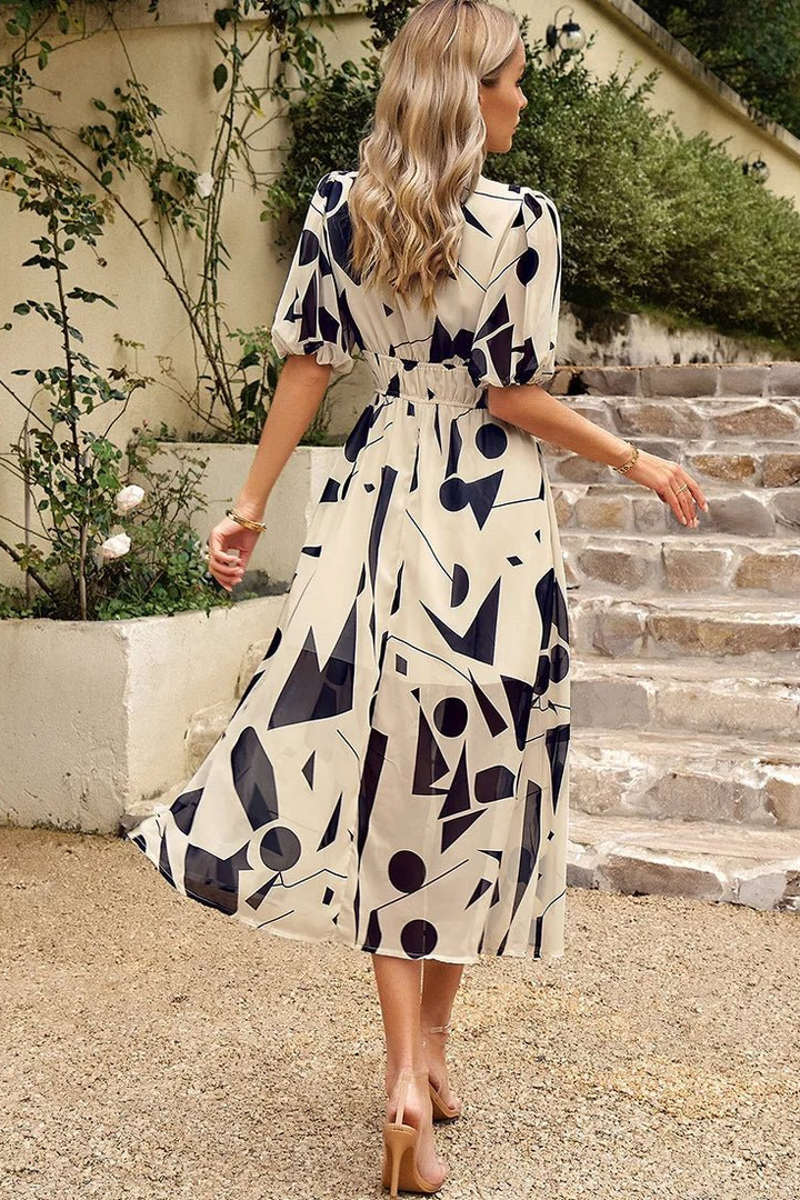 Elegant women's summer midi dress, vibrant floral pattern, puff sleeves & V-neck for parties.