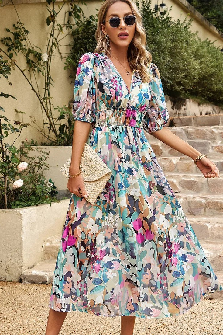Stylish women's puff sleeve midi dress, vibrant floral print, V-neck for versatile occasion wear.