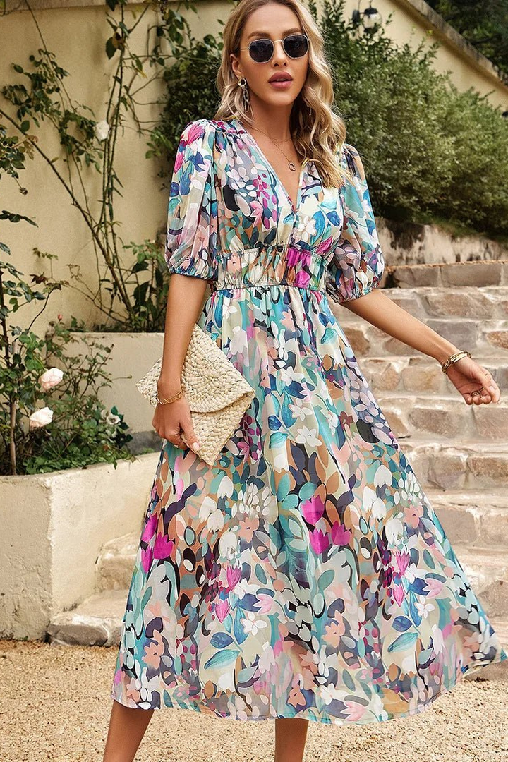 Stylish women's puff sleeve midi dress, vibrant floral print, V-neck for versatile occasion wear.