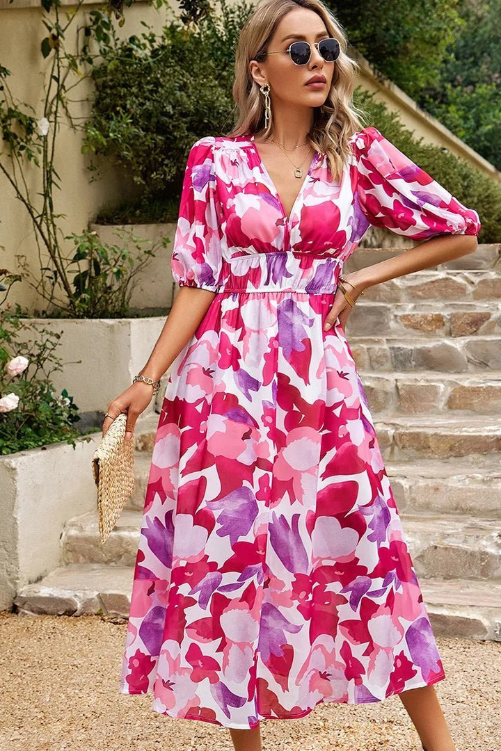 Casual yet elegant floral midi dress for women, features puff sleeves and a flattering V-neck design.