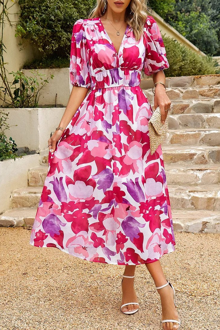Women's summer floral midi dress with chic puff sleeves, V-neck, ideal for garden party fashion.