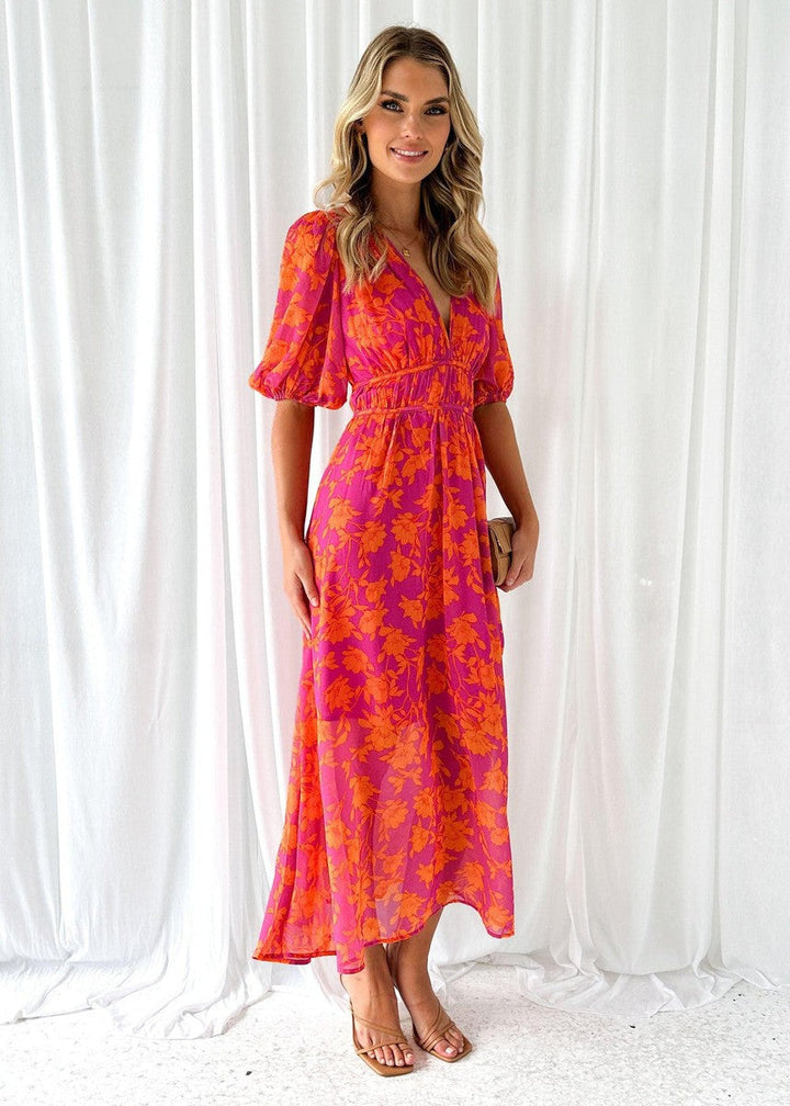 Stylish women's floral midi wrap dress with a flattering V-neck, elegant puff sleeves, great for summer parties.