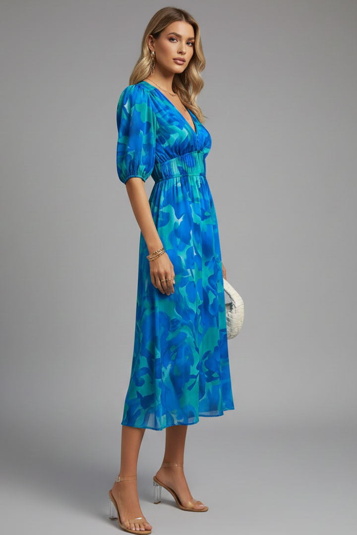 Casual women's summer midi dress, vibrant floral print, comfortable puff sleeves & V-neck. Ideal for day wear.
