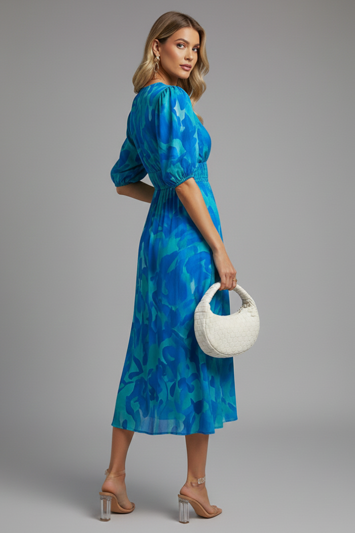 Versatile women's floral midi dress with puff sleeves & V-neck; ideal for spring casual outings or elegant events.
