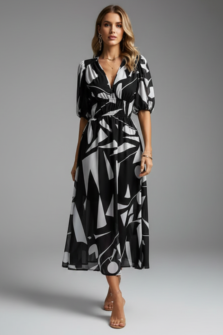 Chic women's spring/summer midi dress with a lovely floral print, puff sleeves, and a flattering V-neck design.