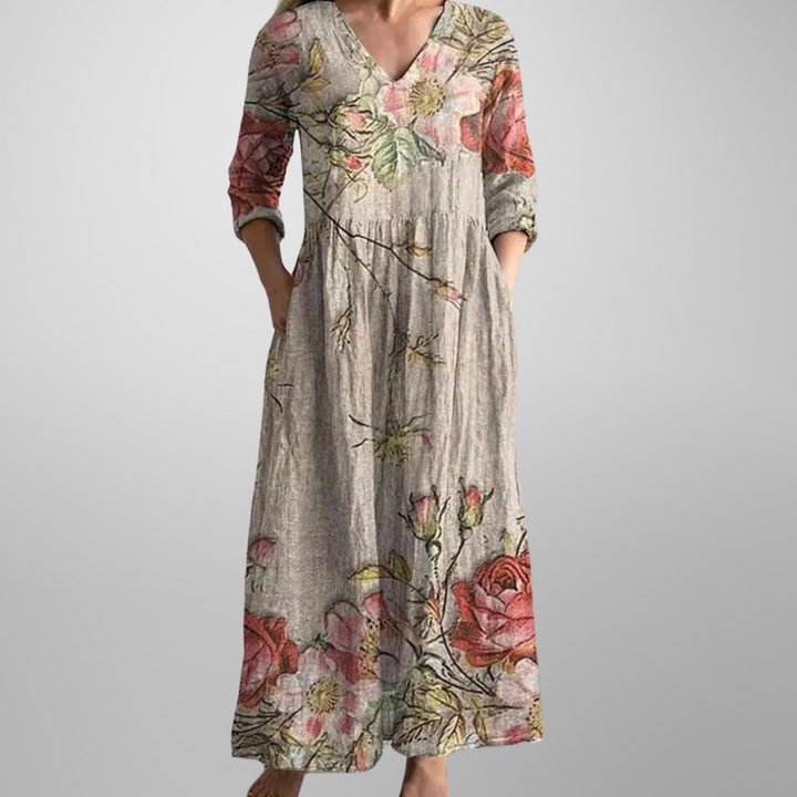 Elegant women's floral print V-neck maxi dress with long sleeves, relaxed fit for spring/summer fashion.