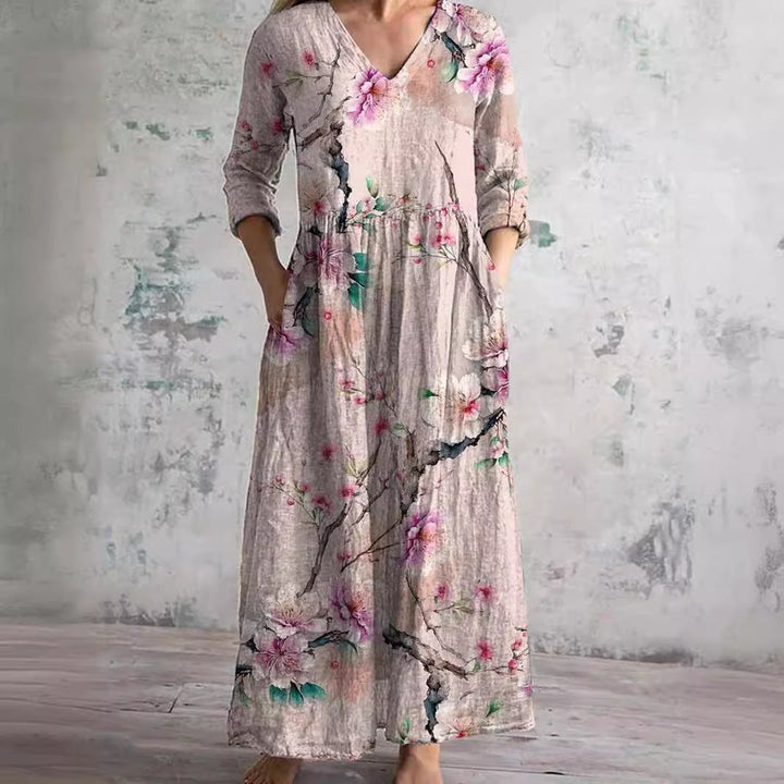Flowy V-neck maxi dress for women, featuring a beautiful floral print, long sleeves, perfect for summer casual elegance.