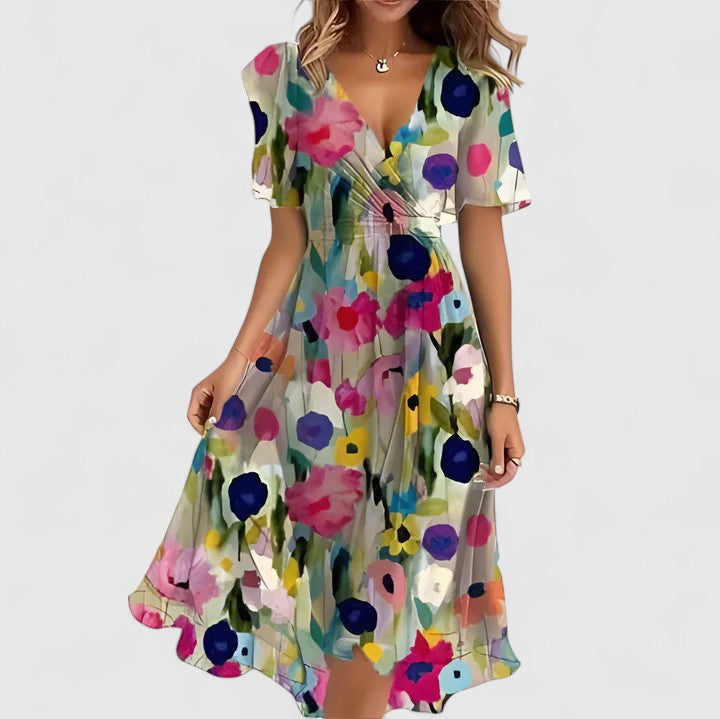 Women's short floral V-neck dress featuring flutter sleeves and a stylish high-low hem for casual elegance.
