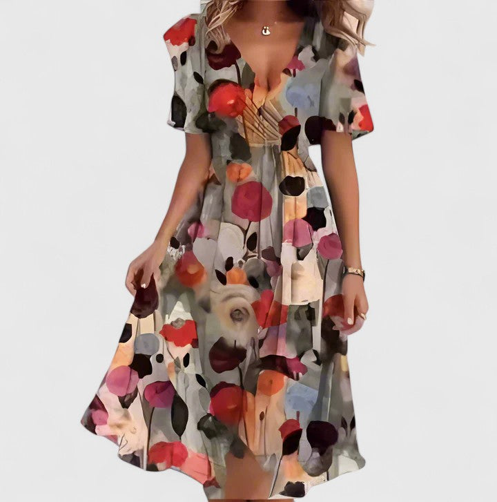 Beautiful women's elegant floral short dress with a flattering V-neck and flowing flutter sleeves.