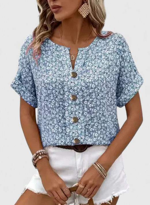 Comfortable women's floral printed summer blouse. Versatile short sleeve top for everyday fashion.