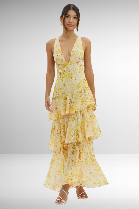 Spring's essential: a women's floral tiered maxi dress, sleeveless and elegantly casual.