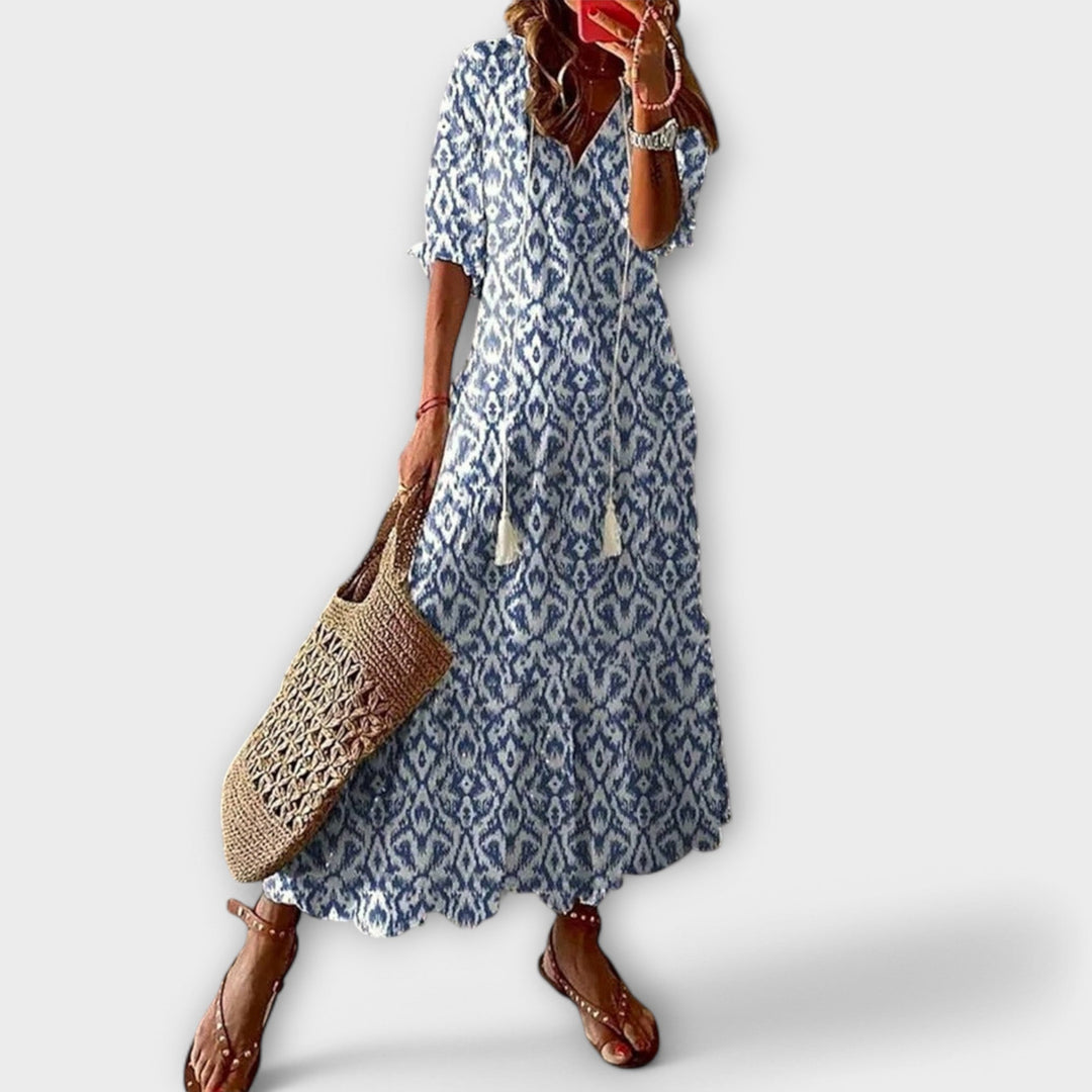 Elegant women's flowy maxi dress, perfect for sophisticated summer events or casual comfort.