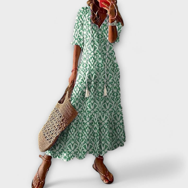 Bohemian flowy maxi dress for women, ideal as a comfortable summer dress or beach outfit.