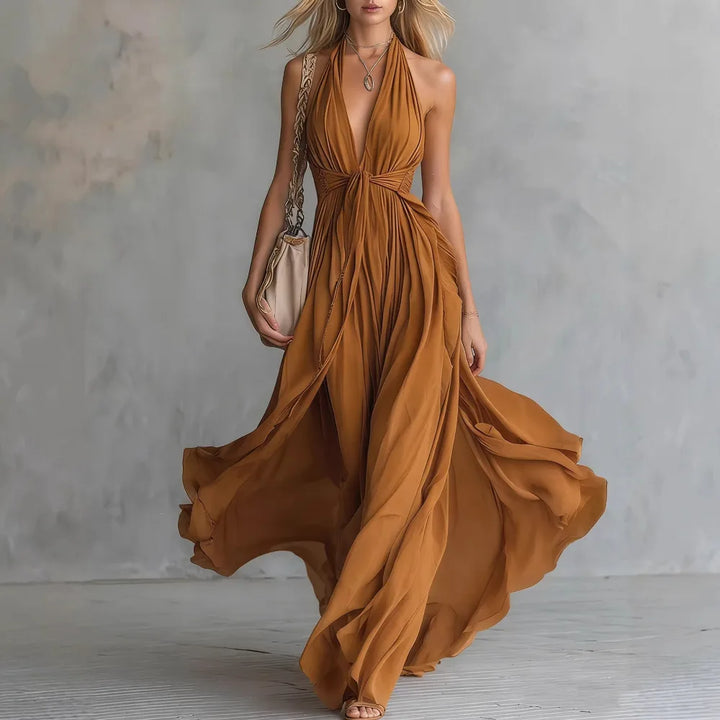 Women's backless halter maxi dress. Pleated, elegant evening gown for formal events & special occasions.