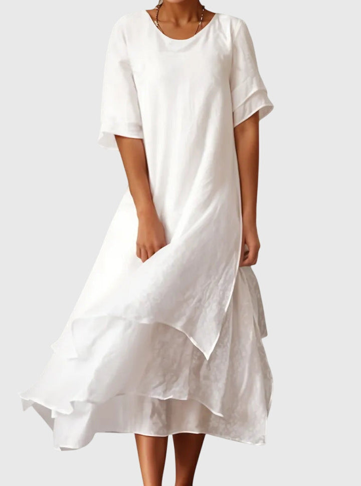 Comfortable and flattering women's flowy dress, ideal for effortless summer style and versatile occasions.