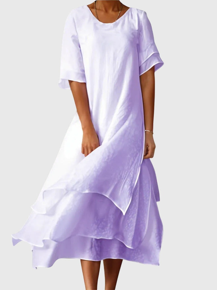 Versatile women's elegant flowy dress, a flattering choice for summer events, from casual to party wear.