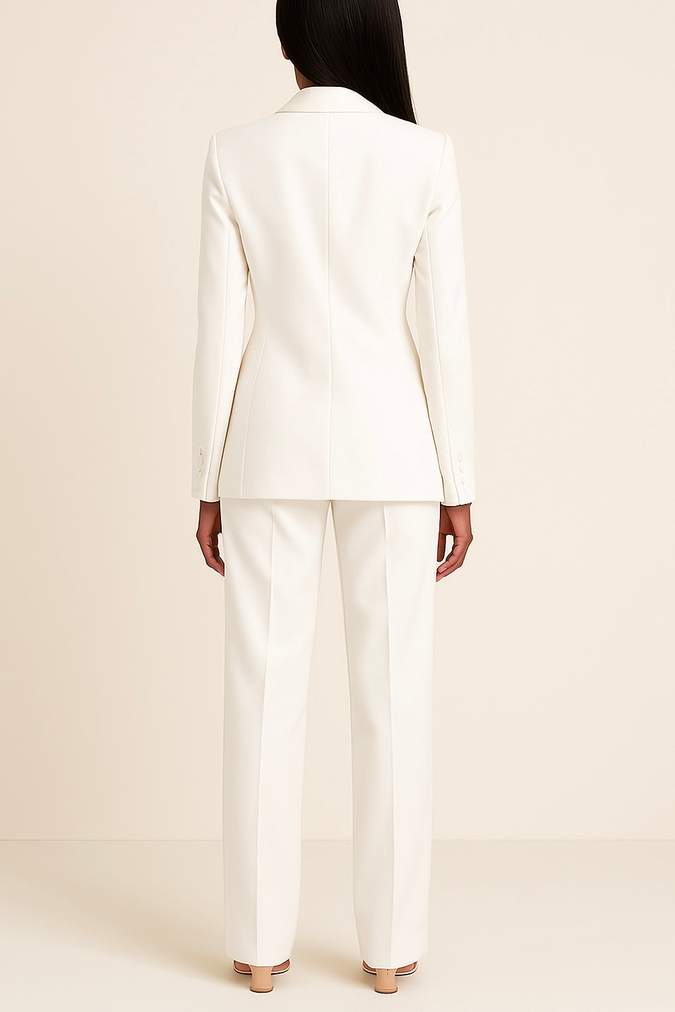 Modern women's elegant suit set: a long, sharp blazer and comfortable, tailored formal trousers for work.