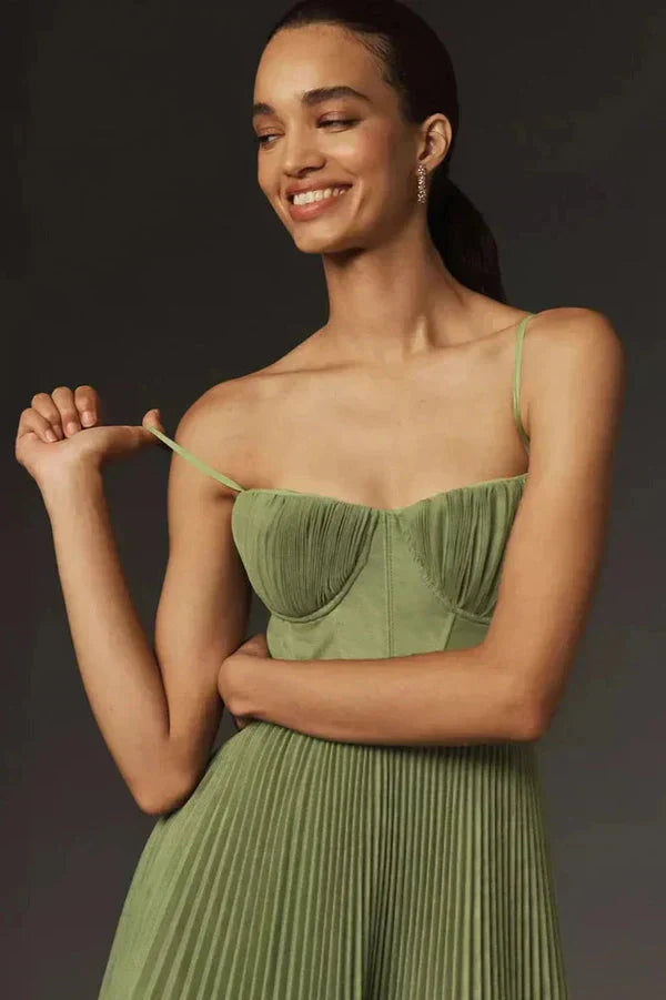 Maxi length pleated dress for women, featuring delicate straps, in a vibrant green hue